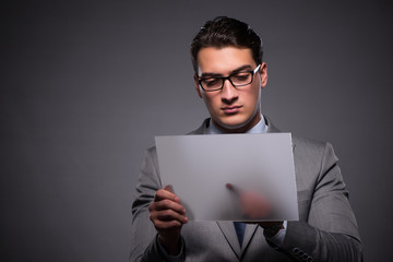 Handsome businessman working on tablet computer