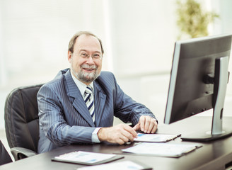 Fototapeta na wymiar successful businessman working with financial charts at the workplace in the office