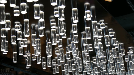 Obraz premium Ceiling lights A row of lights hang suspended from the ceiling.
