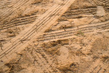 dirt road, urban non asphalt traffic way with tire tracks