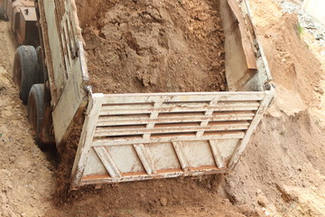 Dump truck is reclaimed for construction work.