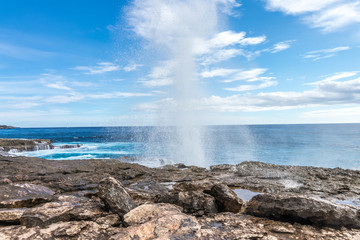 Powerful Waves on a rocky beach, waves splashes. Nusa Lembongan, Bali, Indonesia.