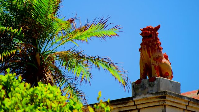 Shisa, a lion shaped statues placed as talisman against evil at entrances and on roofs.