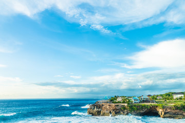 Beach summer with clouds, blue sky and palm tree. Beautiful tropical paradise for holiday and relax copy space background. Bali, Indonesia.