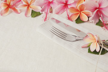 pink and orange summer Flower Table setting copy space background