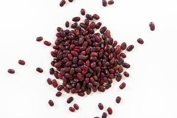 Red beans scattered on the white background