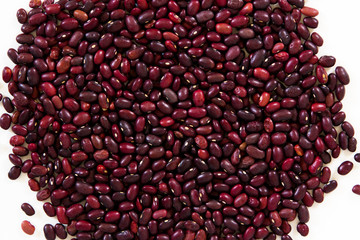 Red beans scattered on the white background