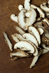 Shiitake mushrooms on a wooden table. Selective focus