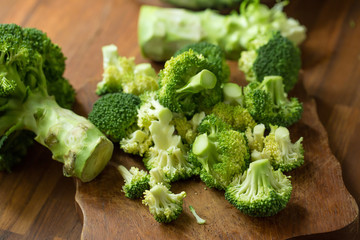 Healthy Green Organic Raw Broccoli Florets Ready for Cooking. Broccoli.Raw fresh broccoli on wooden table