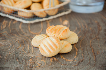 Close up of  heap of freshly baked rice flour ginger cookies on a wooden background.Copy space.