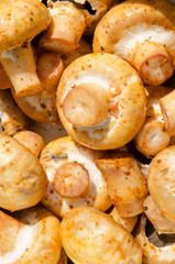 Food mushrooms champignons marinated with seasoning close-up