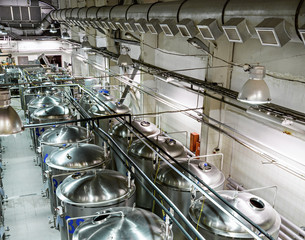 Rows of cisterns from food stainless steel.