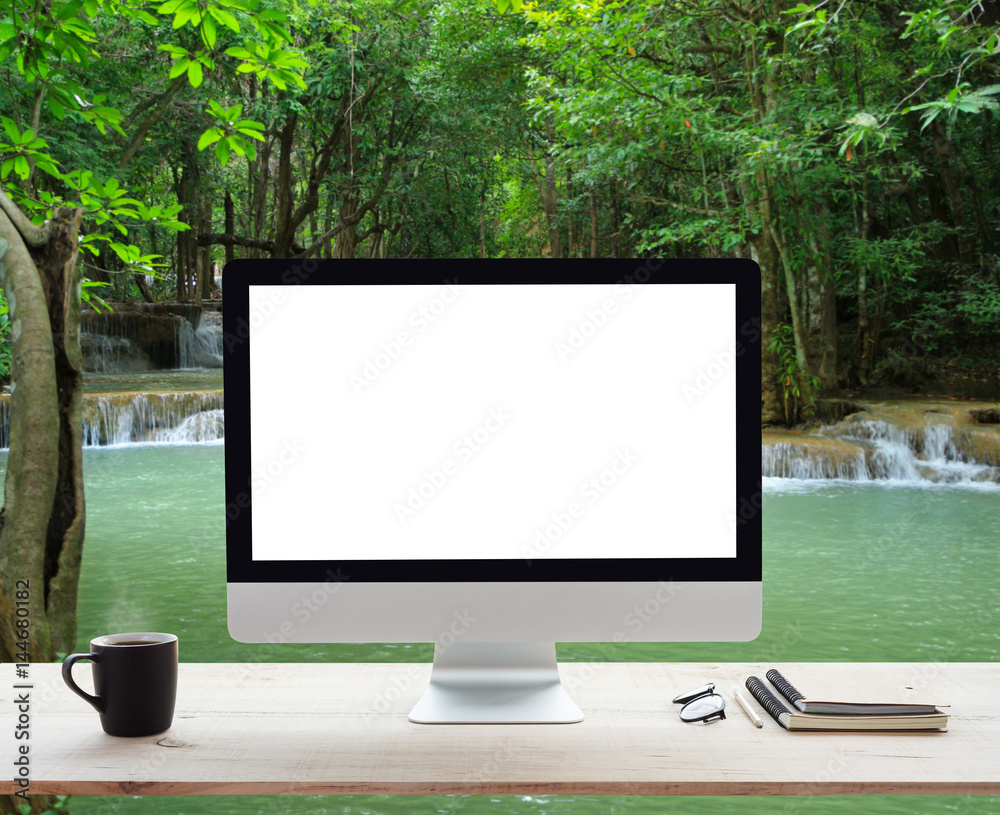 Aufkleber desktop computer white frame on work table and waterfall nature background