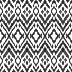 Vector illustration of the black and white colored ikat ornamental seamless pattern. Design in modern ethic style. - 144681564