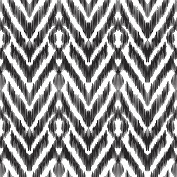 Vector illustration of the black and white colored ikat ornamental seamless pattern. Herringbone design.
