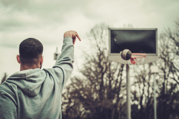 African-american streetball player practicing outdoors