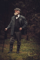 Senior man wearing traditional english clothes outdoors