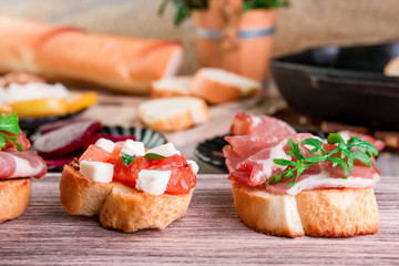 Set of bruschetta on wooden background. Crostini.