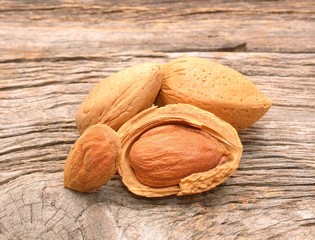 Almonds on wooden background