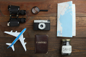  A set of accessories for travel on a wooden background. flat lay