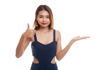 Beautiful young Asian woman show palm hand and thumbs up.