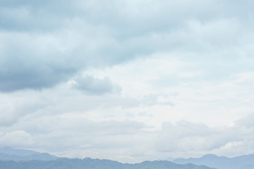 Blue sky in more cloud day with mountain range and abstract background.