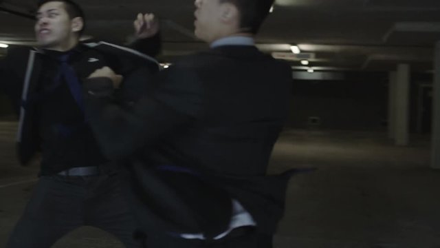 Asian gangster fighting in parking lot with members of a rival gang