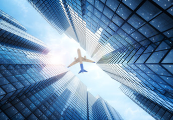 Fototapeta premium airplane flying above building