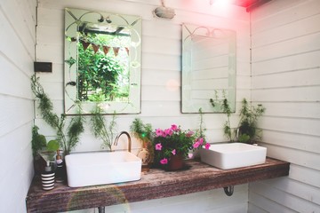 Fototapeta na wymiar Washbasin with nature in home garden, White and beautiful concept