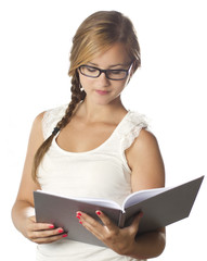 girl with glasses reading a book