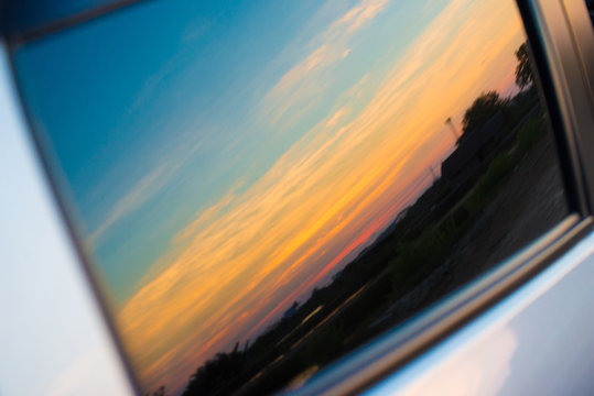 Sunset reflection with car window