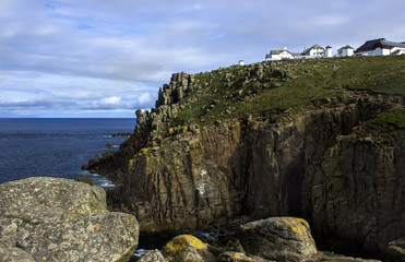 Landscape of towering granite cliffs at Lands End Cornwall England UK Europe