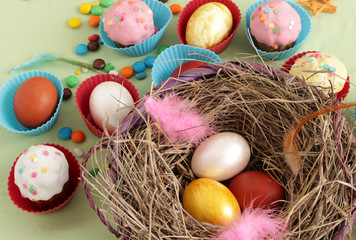 basket with Easter eggs in a nest of hay