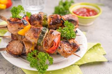 Grilled pork kebab with red and yellow pepper