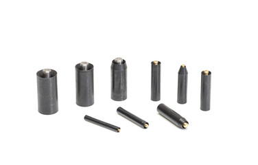 A set of cylindrical steel punches.