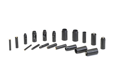 A set of cylindrical steel punches.