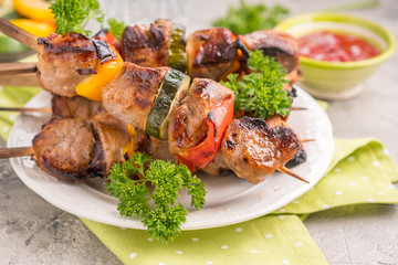 Grilled pork kebab with red and yellow pepper