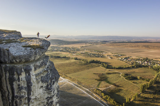 base-jumper jumps from the cliff