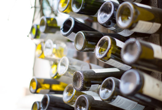 Bottoms Up. Wine Bottles with Light Illumination - Powered by Adobe