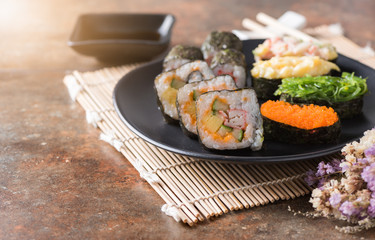 Mix sushi on old brown rust background.