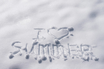 The inscription on the snow "I love summer". The dream of a warm holiday