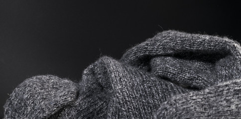 Fototapeta na wymiar Isolated close-up gray wool fabric texture background.