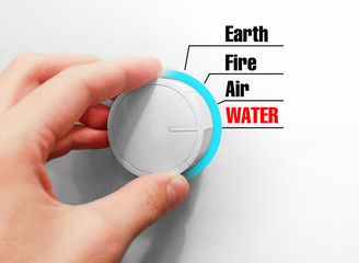 Male hand turns the switch. Switches space. Chose the Water