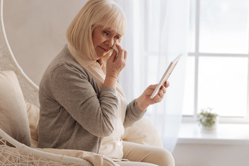 Depressed aged woman crying