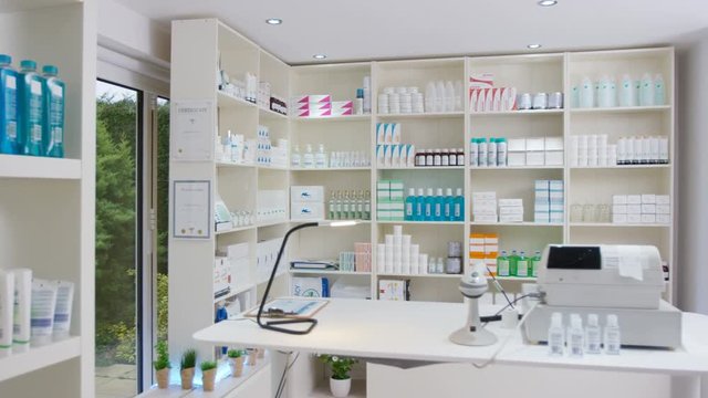  Interior view of a modern chemist shop. No people. 