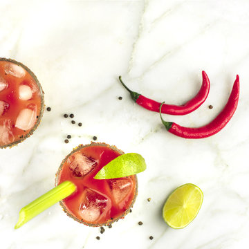 Bloody Mary Cocktails, Shot From Above On White Marble