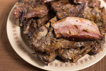 Served bacon and meat on the table