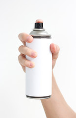 Man's hand holds a spray of black paint. Isolated on a white background