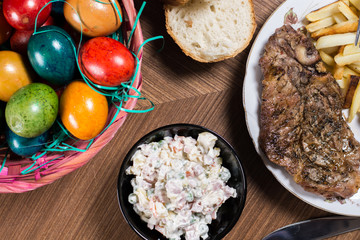 Served lunch on the table with meat and Easter eggs