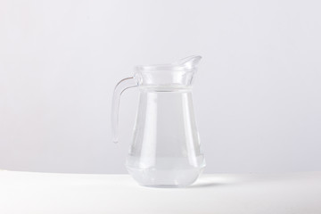 glass jug with water isolated on white background